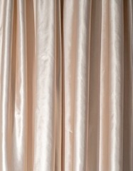 Fototapeta premium Beige Silky Curtain in Vertical Folds for Interior Decoration and Backdrops