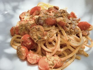 spaghetti long Italian pasta with fresh cherry tomatoes and vegetable sauce