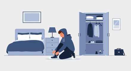A young man tying his shoelaces in his bedroom, preparing for the day