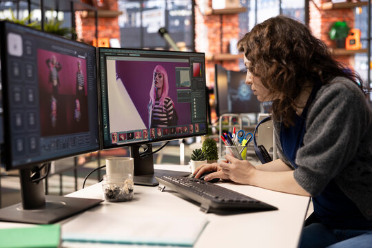 Female designer working with AI chat bot and an editing software, retouching and turning text prompt into photos. Photographer editor using machine learning, generative materials.