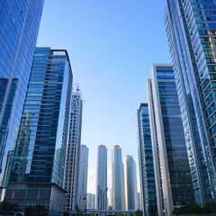 Fototapeta premium Modern Skyscrapers Silhouette Against a Clear Sky