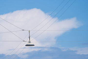 Urban Overhead Streetlight Against a Blue Sky