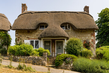 Pair of cute thatched semi-detached cottages on hill in Godshill on the Isle of Wight