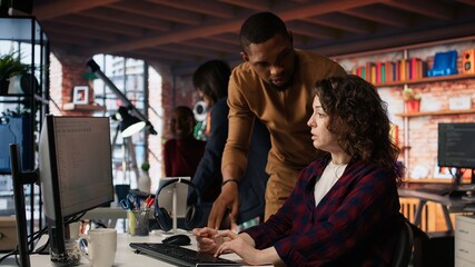 AI startup office chief technology officer overseeing woman building application. Manager assisting worker in artificial intelligence software development agency, offering advice, camera A