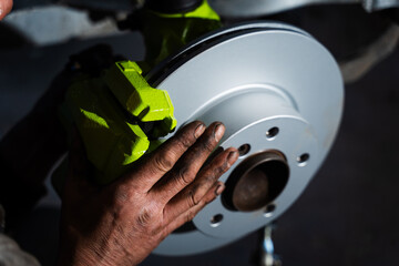 New brake rotor and caliper installation on custom suspension. High-performance brake and coilover...