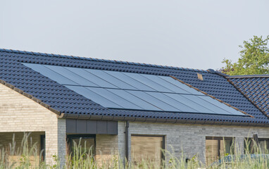 New Beige Brick House with in roof integrated Solar Panels