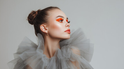 Elegant model with striking makeup and neutral background with copy space, high fashion image for beauty, cosmetics, couture campaigns