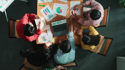 Top view of manager working on laptop while analyzing data with smart team looking screen and discuss about idea. Group of smart people giving high five and clapping hands. Time lapse. Convocation. - Powered by Adobe