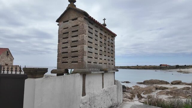 Picturesque h&oacute;rreo standing on the galician coast, showcasing the region's unique architectural heritage and tranquil seaside beauty