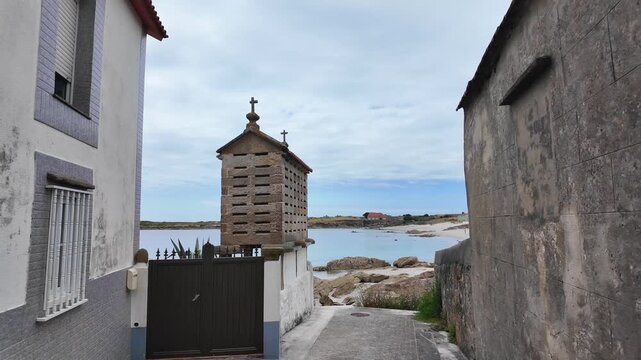 Picturesque h&oacute;rreo standing on the galician coast, showcasing the region's unique architectural heritage and tranquil seaside beauty