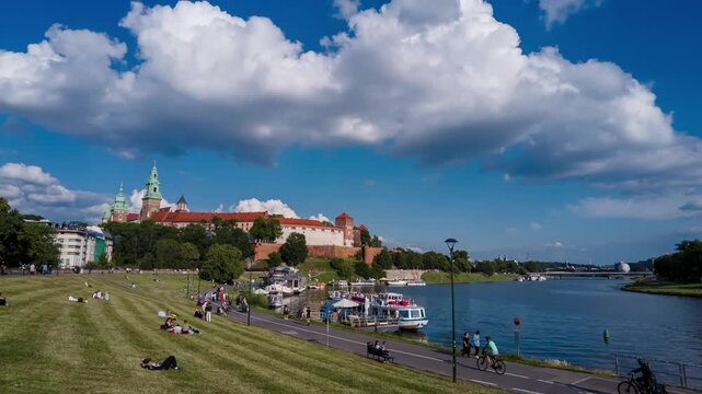 Time lapse of Wawel castle and Visla Vistula river with tourist boats in Krakow, Poland