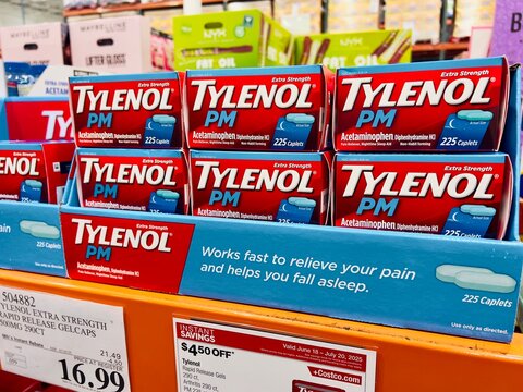 Small cartons boxes containing plastic bottles of TYLENOL PM Extra Strength Nighttime Pain Reliever & Sleep Aid Capsules for sale at a local Costco warehouse store