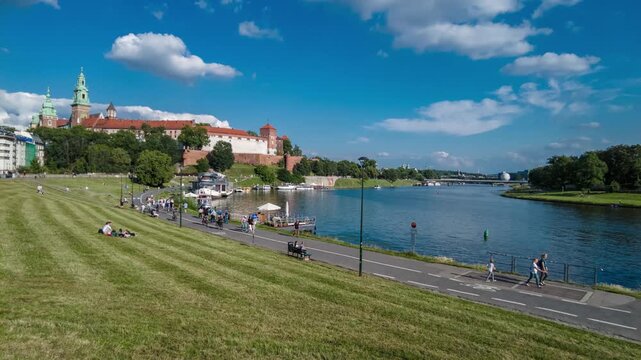 Time lapse of Wawel castle and Visla Vistula river with tourist boats in Krakow, Poland