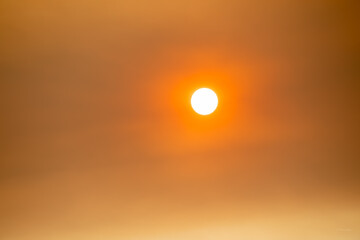 Dawn in smoky air after a fire in Wyoming, red clouds, dramatic 