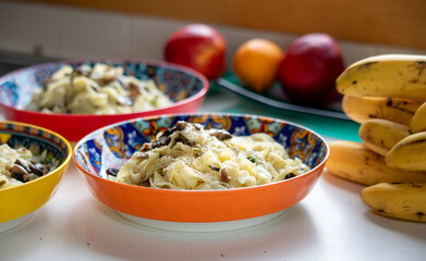 Home made Italian tagliatelle with mushroom in beautiful decorated dish