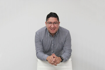 30-year-old Latino man with glasses is proud to be a successful business entrepreneur