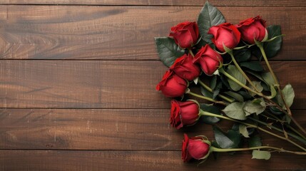 Bright red roses beautifully arranged on a rustic wooden background, perfect for framing your heartfelt messages.