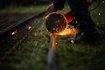 A man uses a grinder