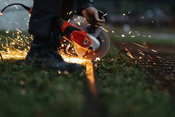 A man uses a grinder