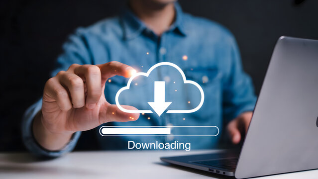Man downloading data from cloud storage to laptop for seamless digital transfer