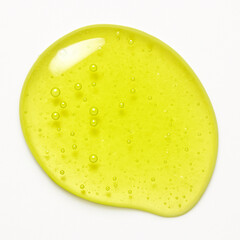 Bright lime green gel swatch with bubbles and shimmer on white background. Glossy, translucent texture. Cosmetic skincare product