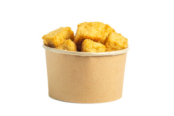 Crispy tofu (tahu crispy) in a paper bowl. Indonesian street food.