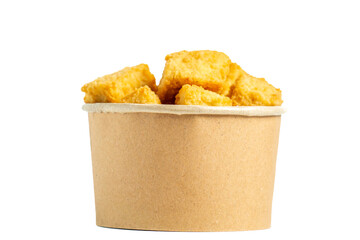 Crispy tofu (tahu crispy) in a paper bowl. Indonesian street food.