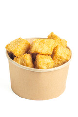 Crispy tofu (tahu crispy) in a paper bowl. Indonesian street food.