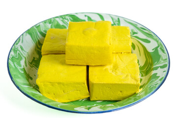 Tahu takwa (tahu kuning, tahu yellow tofu), traditional tofu from Kediri, East Java.This yellow color is tofu soaked with turmeric.