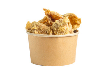 Keripik kulit ayam (Chicken skin chips) in a paper bowl. Indonesian street food.