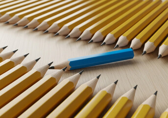 Obraz premium Yellow pencils blue pencil leadership concept unique individuality standing out from the crowd creativity