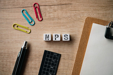 NPS wood cube for Business. An abbreviation for Net Promoter Score, ideal for content on corporate strategy and customer loyalty.