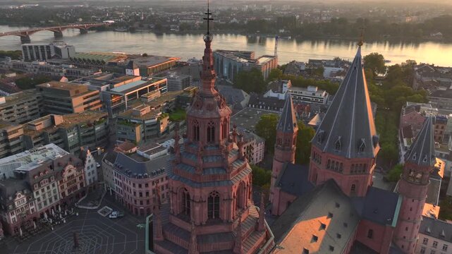 Mainz at Sunrise, Aerial Dawn Drone Shot, Showing Old Town and Cathedral of Mainz, Germany. Main River with Orange Sky