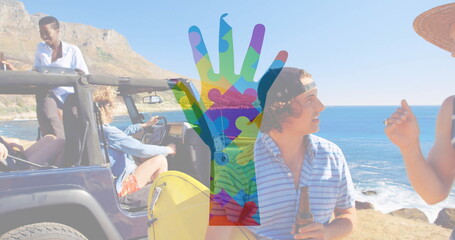 Posing five friends wearing straw hat holding yellow surfboard and bottle at coastal overlook jeep