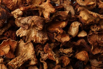 Many dried chanterelle mushrooms as background, closeup