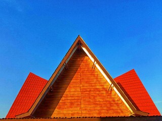 Traditional Indonesian house roof with blue sky background