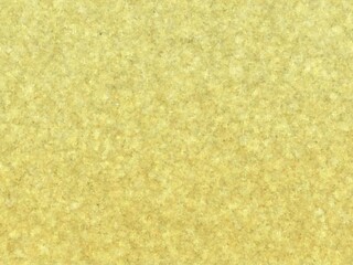 Abstract pale yellow textured background with subtle speckles