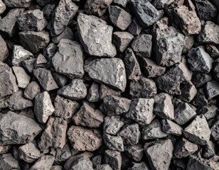 Close-up view of a large pile of dark gray and black rocks.