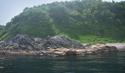 Amazing Multi-layered lava rock on Iturup Island sea shore