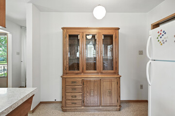 Kitchen with a wooden cabinet and a white refrigerator