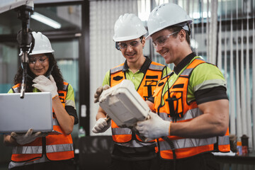 Smart Latino engineer working on AI technology in robotics electronics engineering laboratory. Hispanic students' research project is programming robot machine with intelligent mechanical control