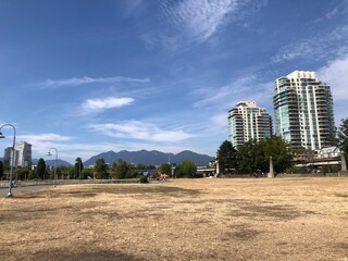 Fototapeta premium View of North Shore Mountains from Park Near Science World, Vancouver on a Sunny Summer Day