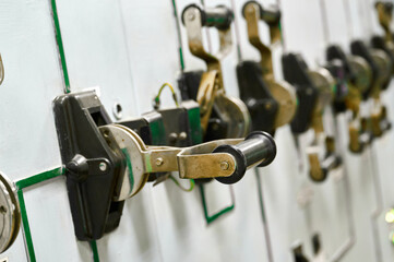 Obraz premium Vintage control panel with mechanical levers and switches in industrial setting