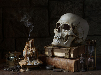Still life with Extinguished Candle, Skull, and Antique Objects. 
