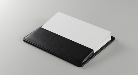 Sleek black leather portfolio holding blank white paper.