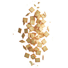 Golden Square Crackers Scattered Against Black isolated on a transparent background food snack