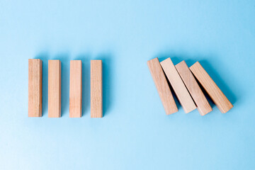 Top View Of Wooden Blocks Show A Domino Effect Interrupted By A Gap, Symbolizing Prevention Or...