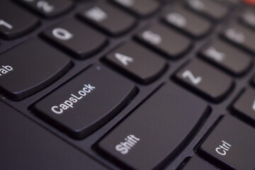 computer keyboard close up of a key caps lock