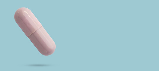 Purple medicine pill capsule float on blue background