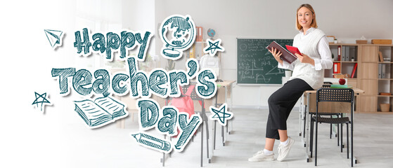 Mature female math teacher with notebook and calculator sitting on desk in classroom